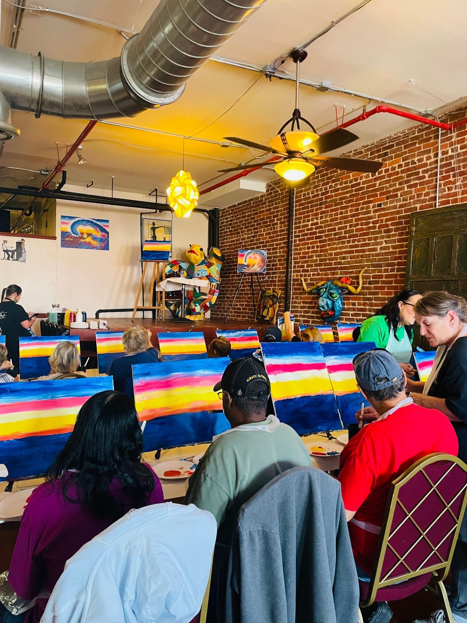 A group of people are sitting at tables in a room.