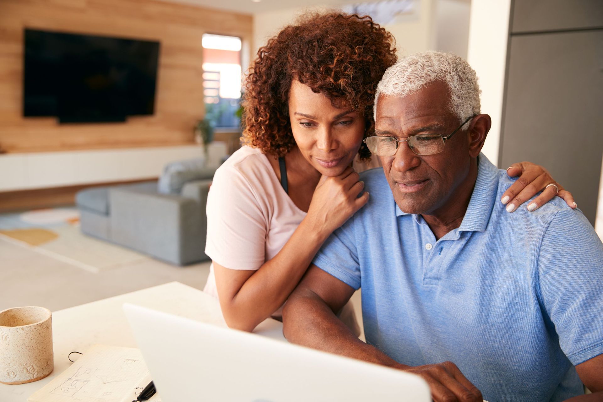 Couple analyzing information on computer screen