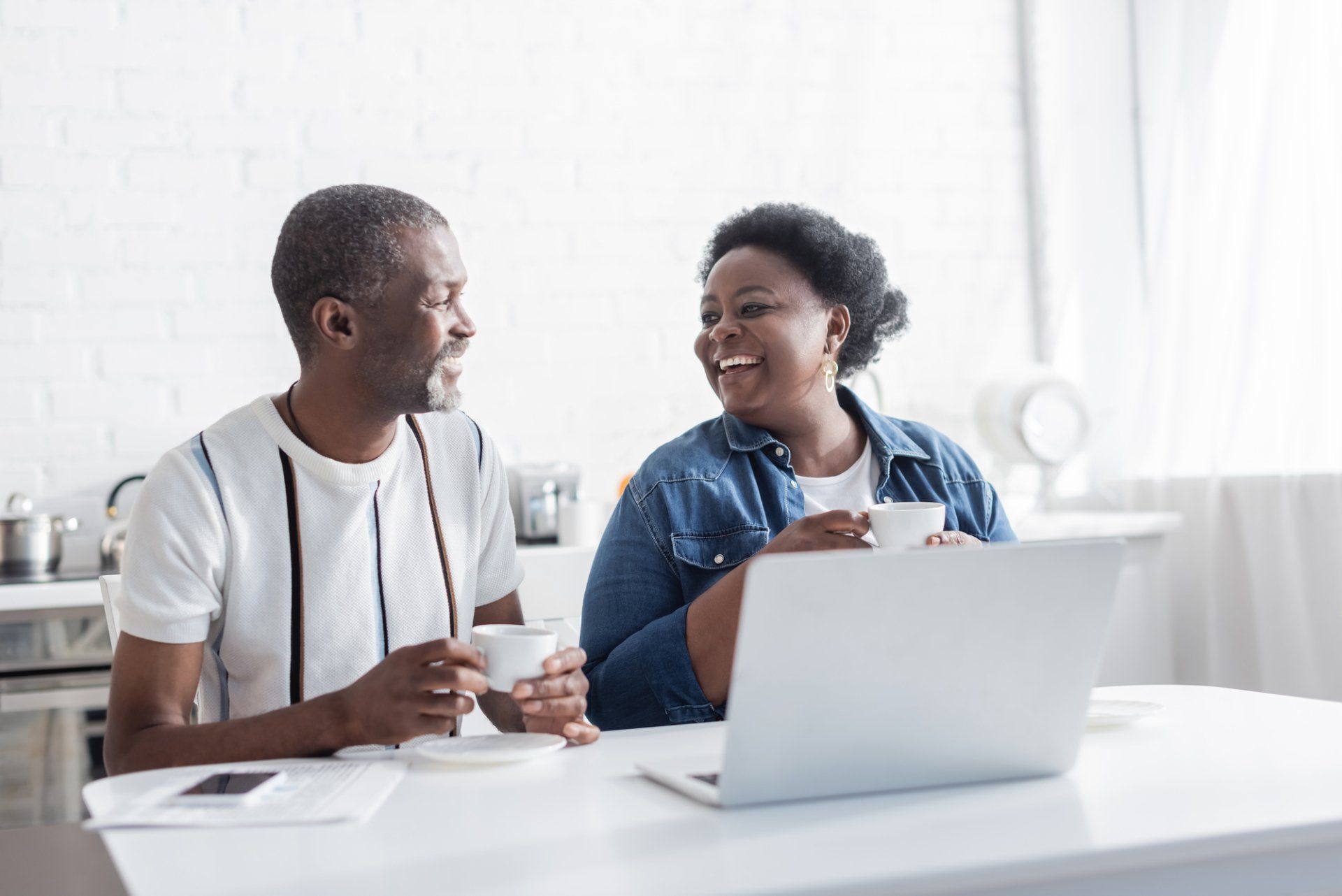 a happy black couple who are planning for their retirement together