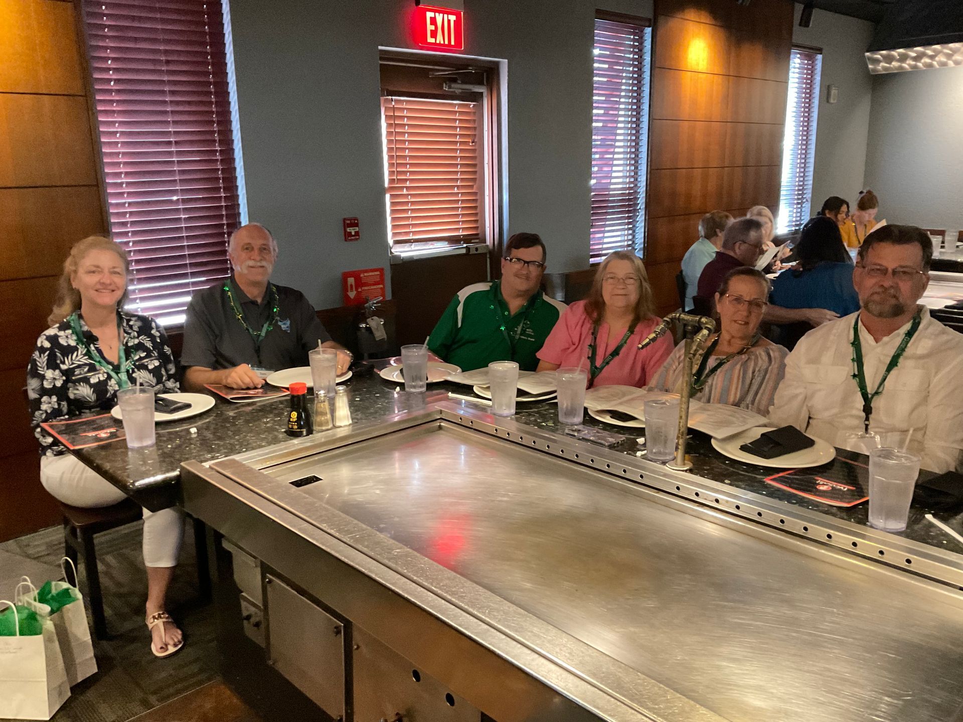 Summerlin clients sitting at a habachi table for a client appreciation dinner