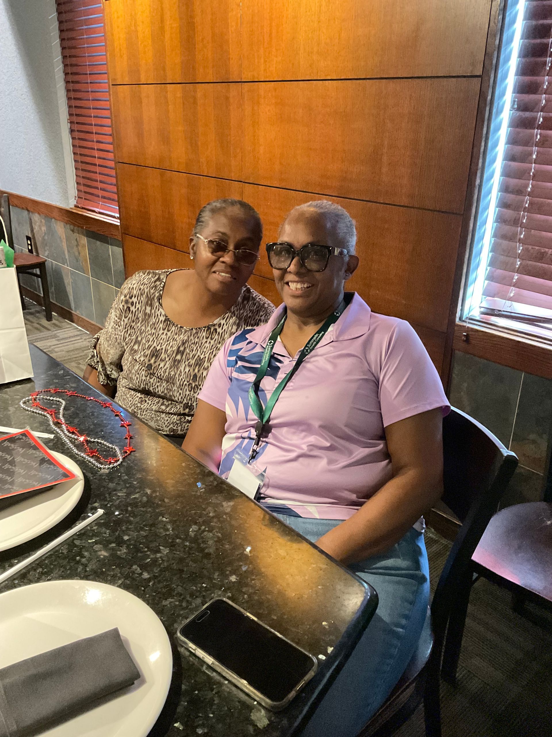 Two Summerlin clients are sitting at a table in a restaurant