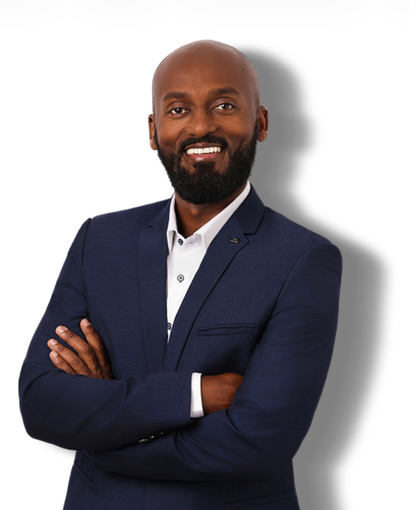 Studio portrait of a smiling man in a dark suit and tie on a white background