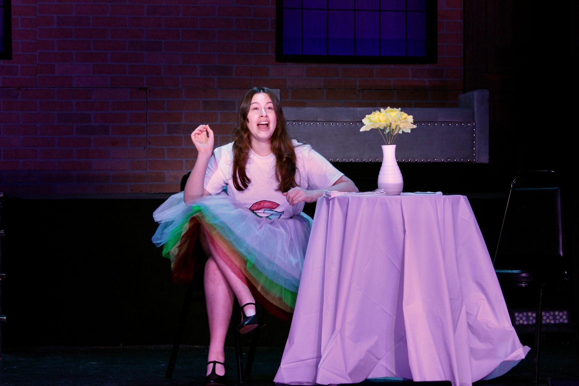 Student performer on stage during First Date
