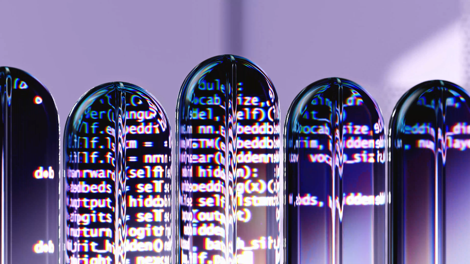 Blue-lit glass cylinders with scrolling code on a purple background