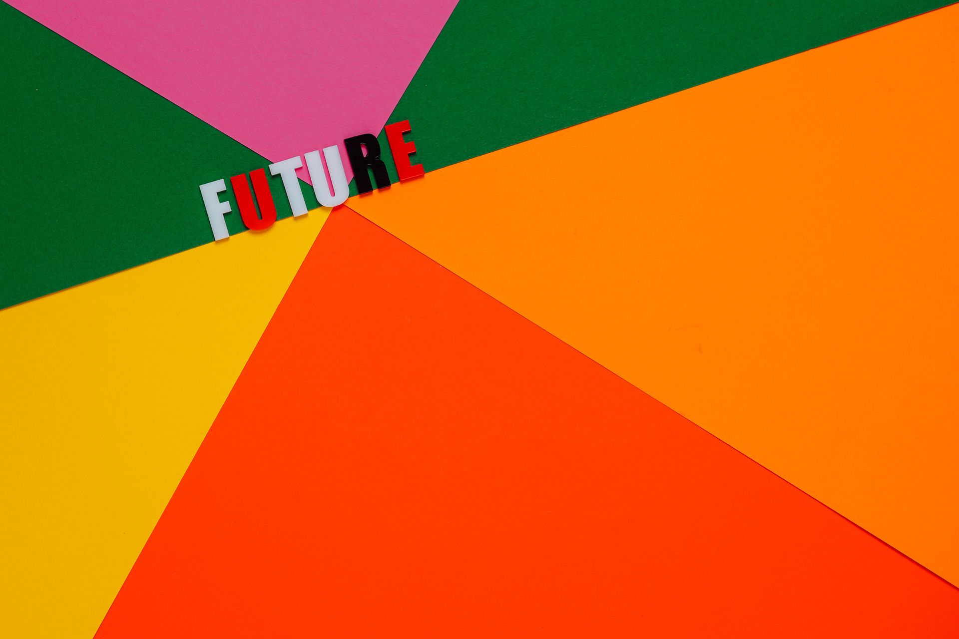 Colorful geometric background with the word “FUTURE” in white and red near the top left.
