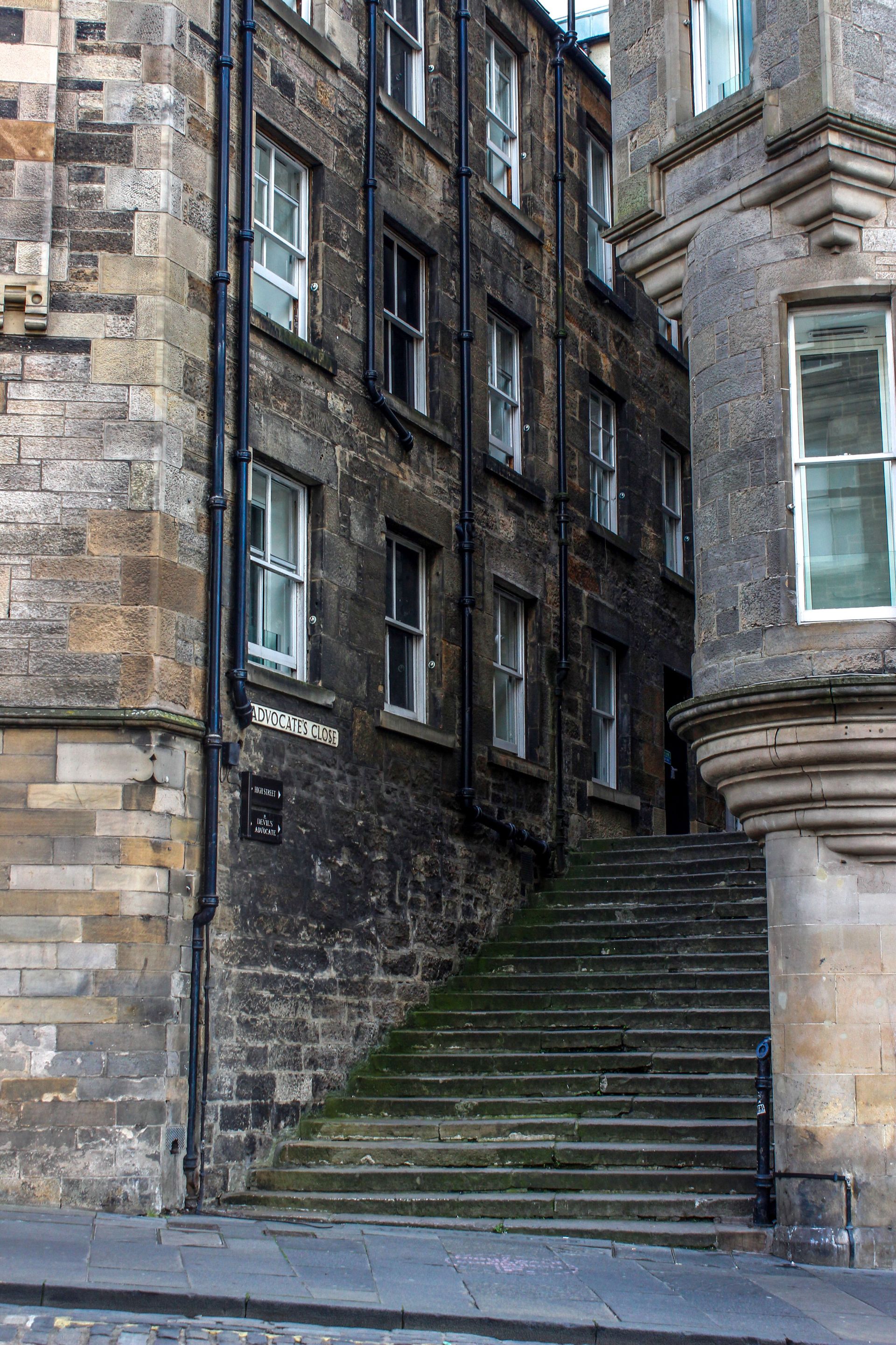 Stone stairway between old brick buildings in a narrow alley