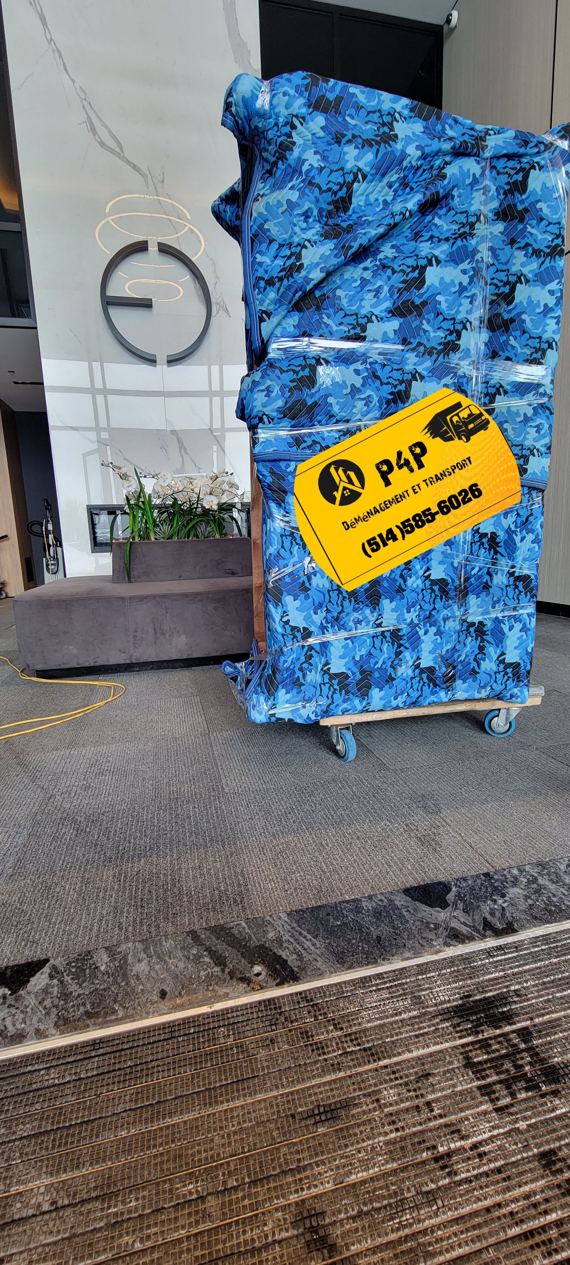 A large blue box is sitting on top of a wooden table.