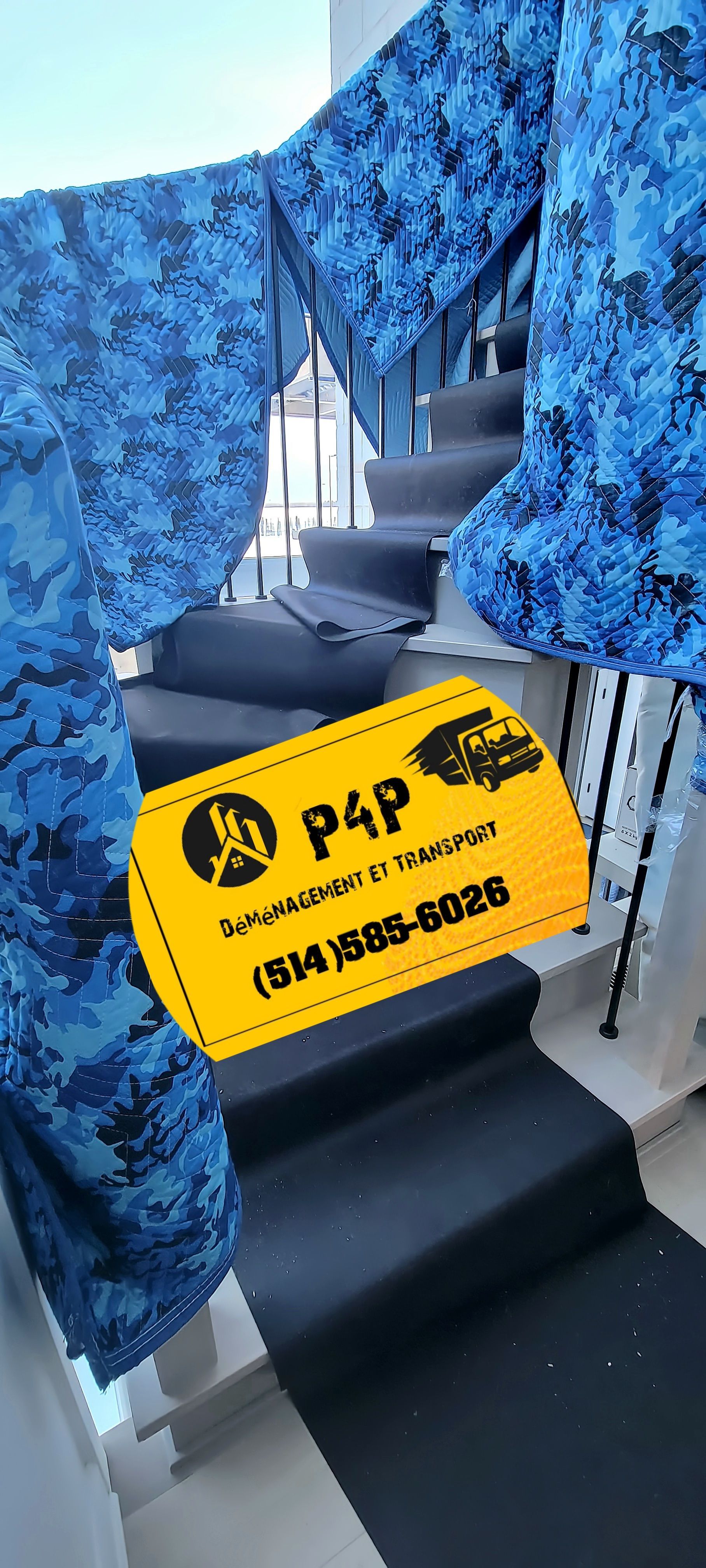 A blue and black staircase with a yellow sign on it.