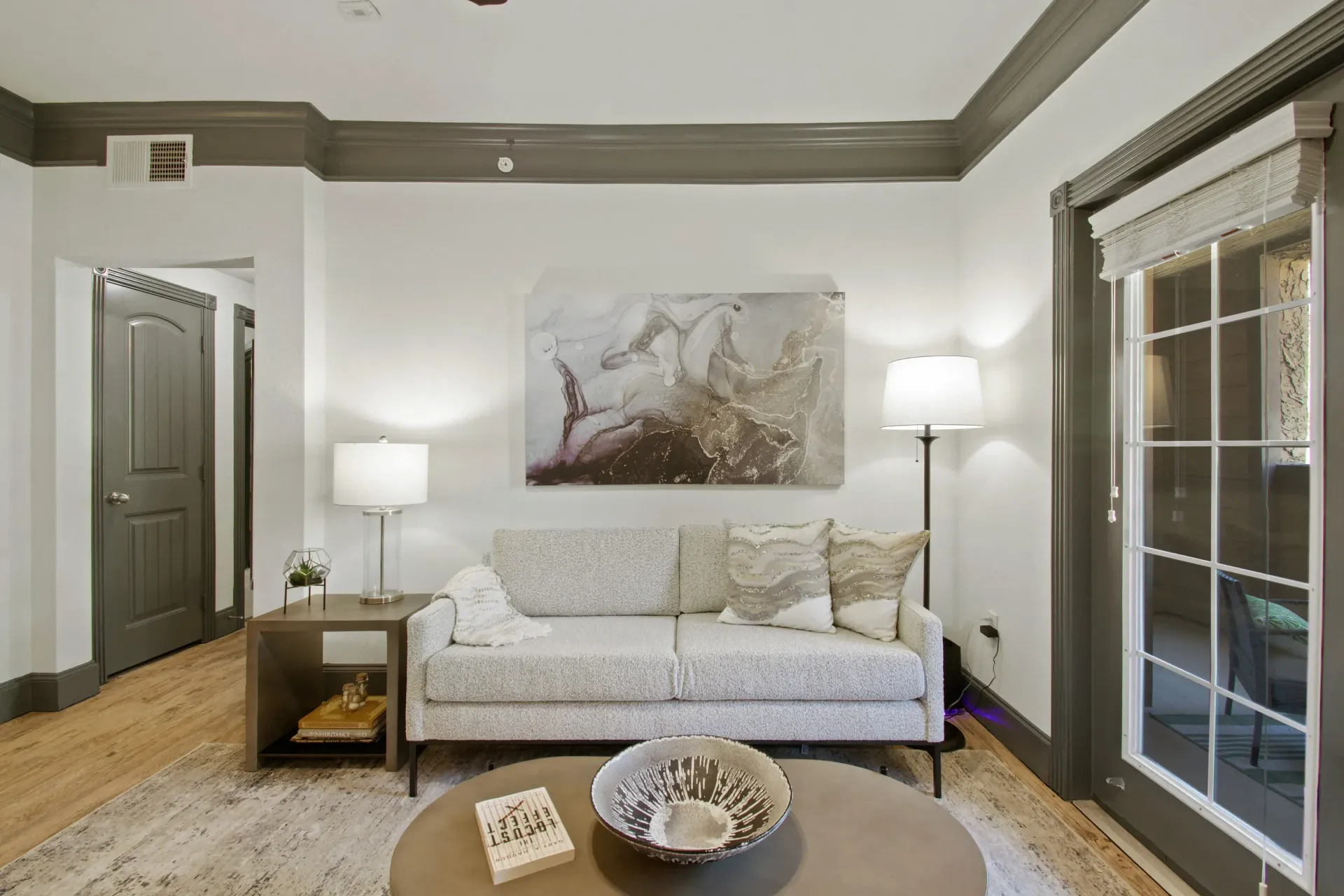 Open-concept kitchen with stainless steel appliances, a large island, and wood floors.