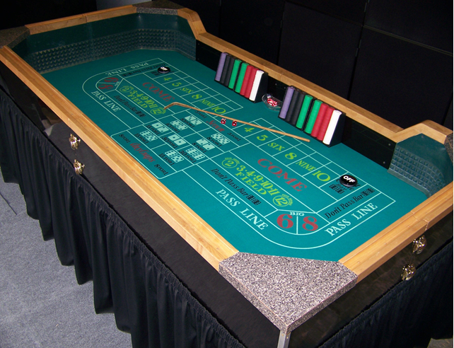 A group of people are playing poker at a table in a casino.
