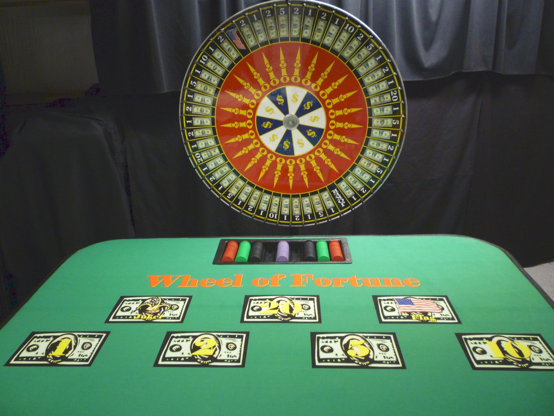 A group of people are playing roulette in a casino.