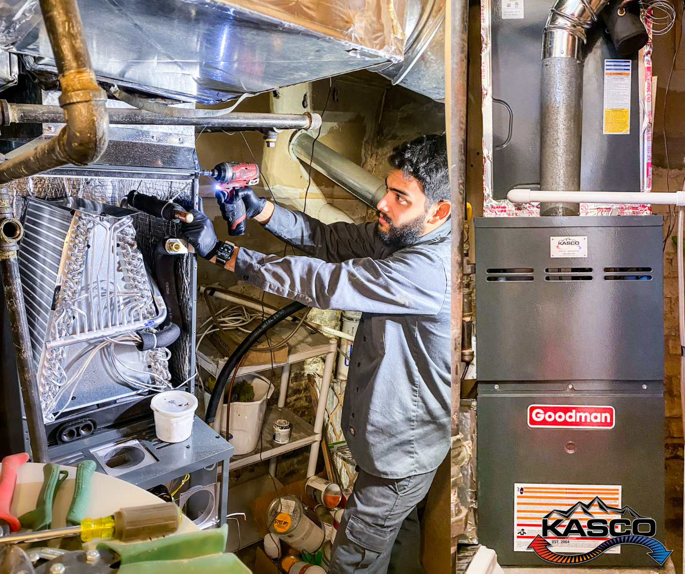 A man is working on an air conditioner in a basement.