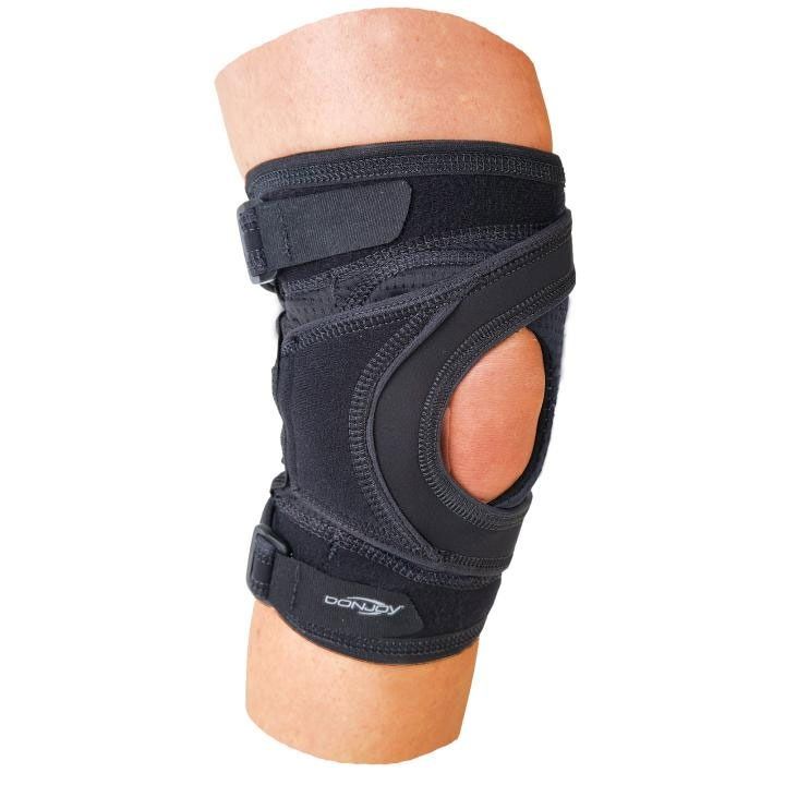 Black knee brace with side cutout on a leg