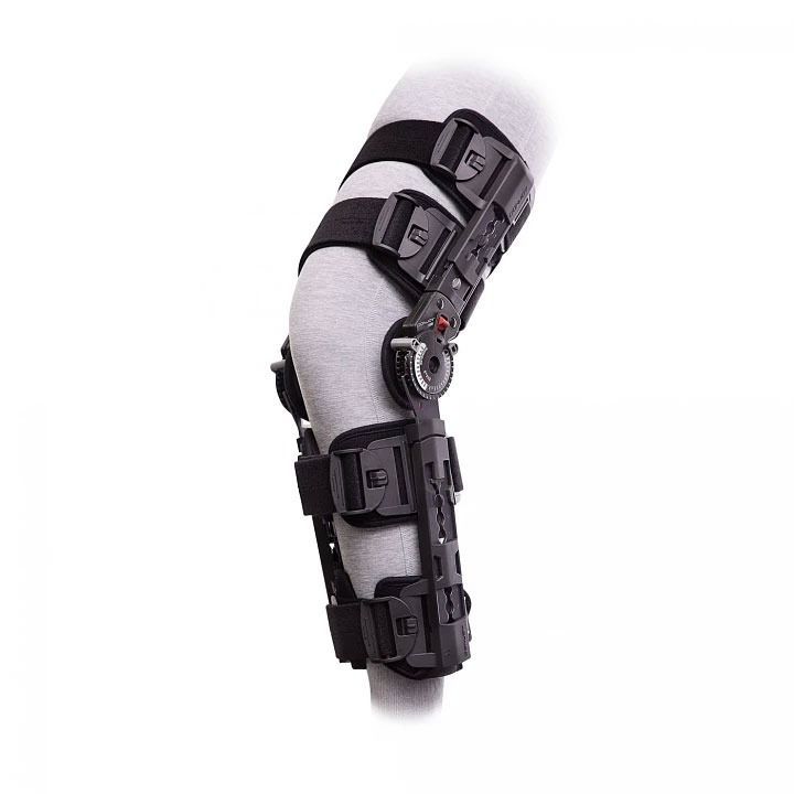 Black hinged knee brace with adjustable straps on a white background