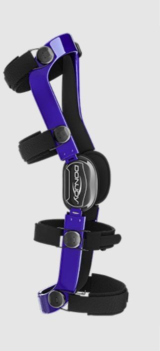 Purple-and-black adjustable knee brace with metal hinges and straps on a white background