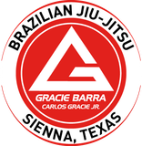 Gracie Barra Brazilian Jiu-Jitsu logo with red circle and white triangle, Sienna, Texas