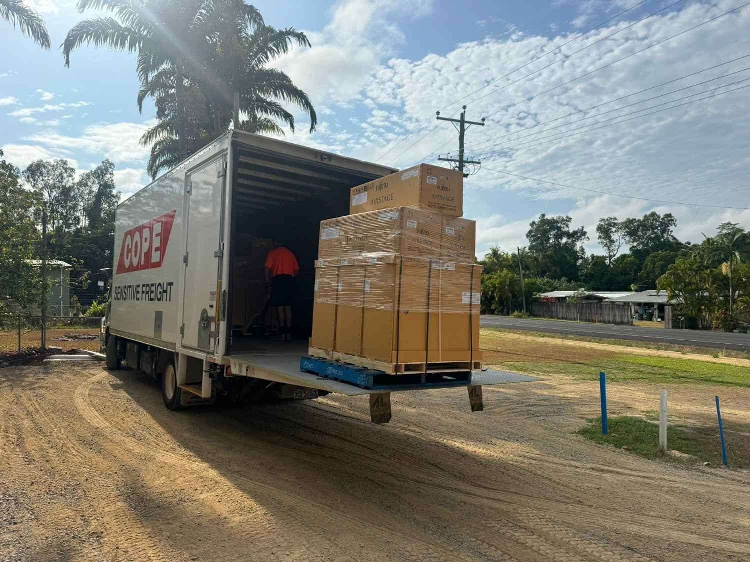 Truck Unloading Boxes on A Pallet — Magneto HVAC in Tablelands, QLD