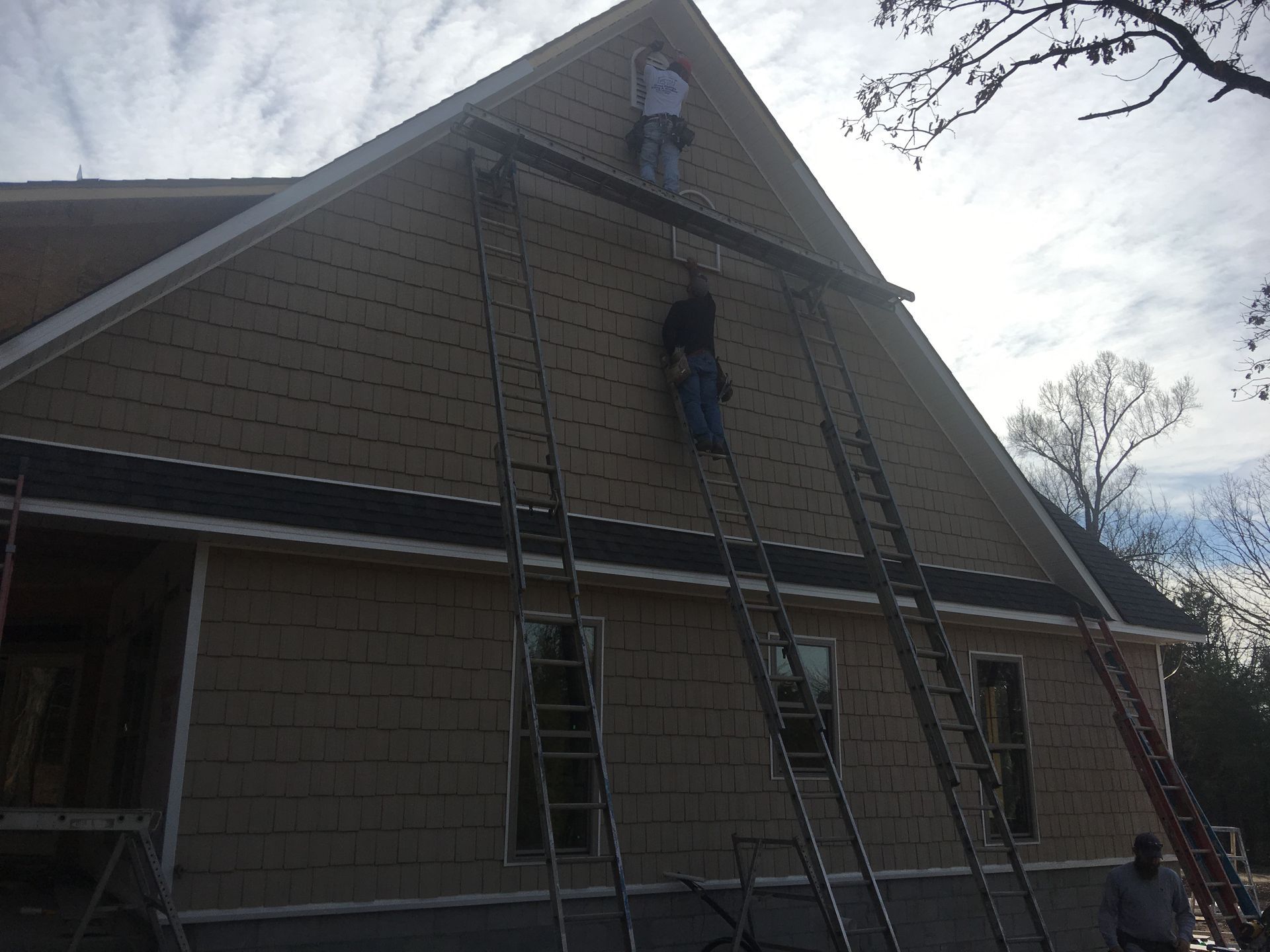 Shane Phillips Siding & Windows Workers on Back of House