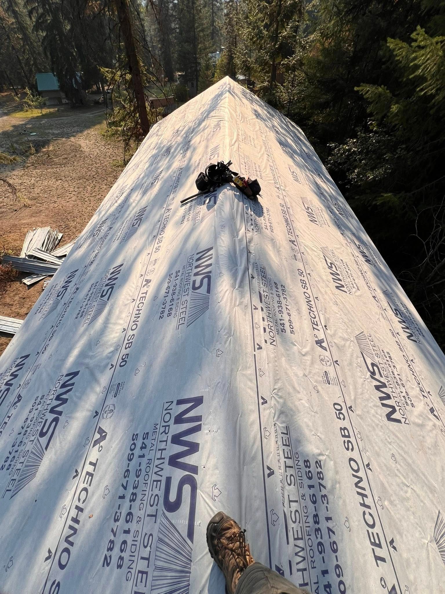 Rooftop covered in silver tarp with 