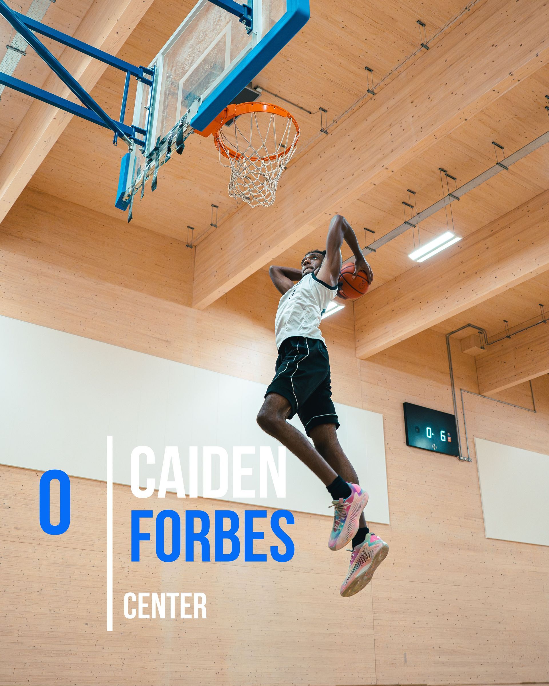 Basketball player, Caiden Forbes, dunks at the Center.