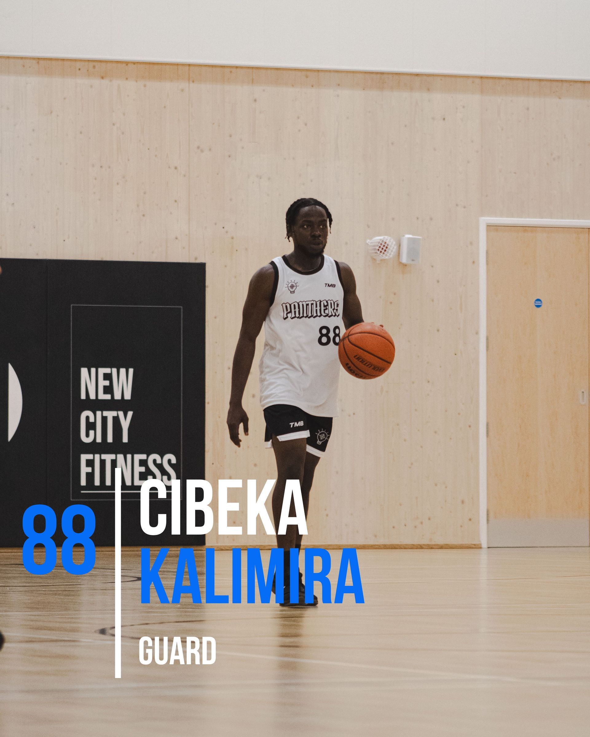 Basketball player Cibeka Kalimira dribbling a ball on a court; wears a white jersey, number 88.
