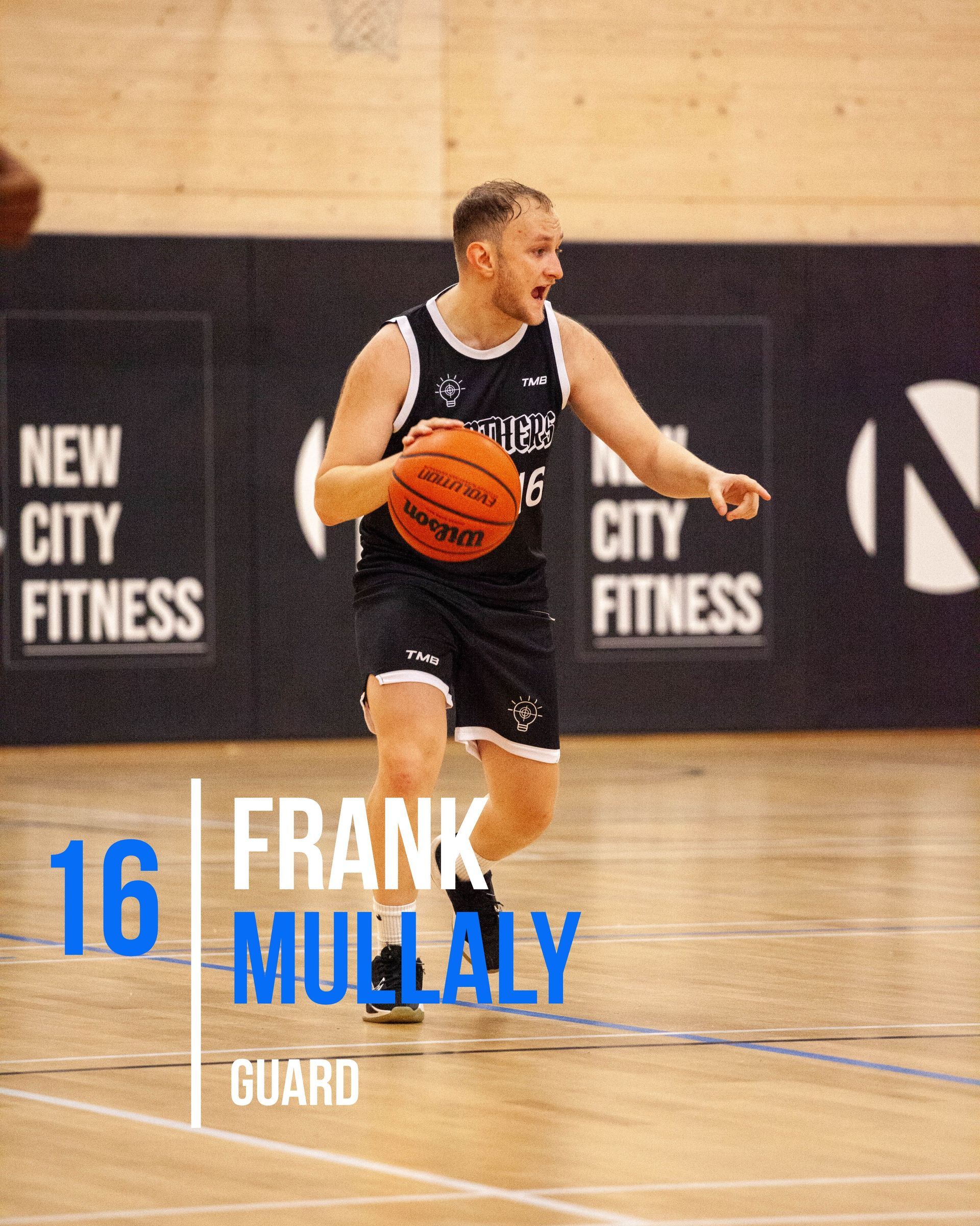 Basketball player Frank Mullaly, number 16, dribbling the ball on court.
