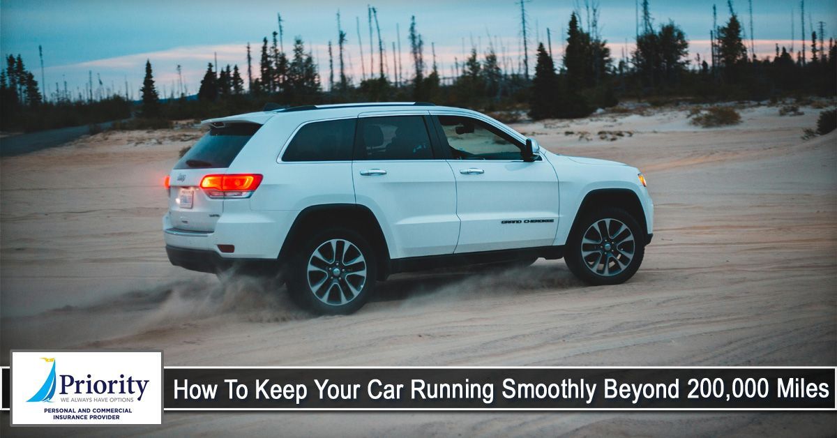 White SUV driving on sand