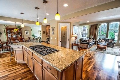 There is a large island in the middle of the kitchen.