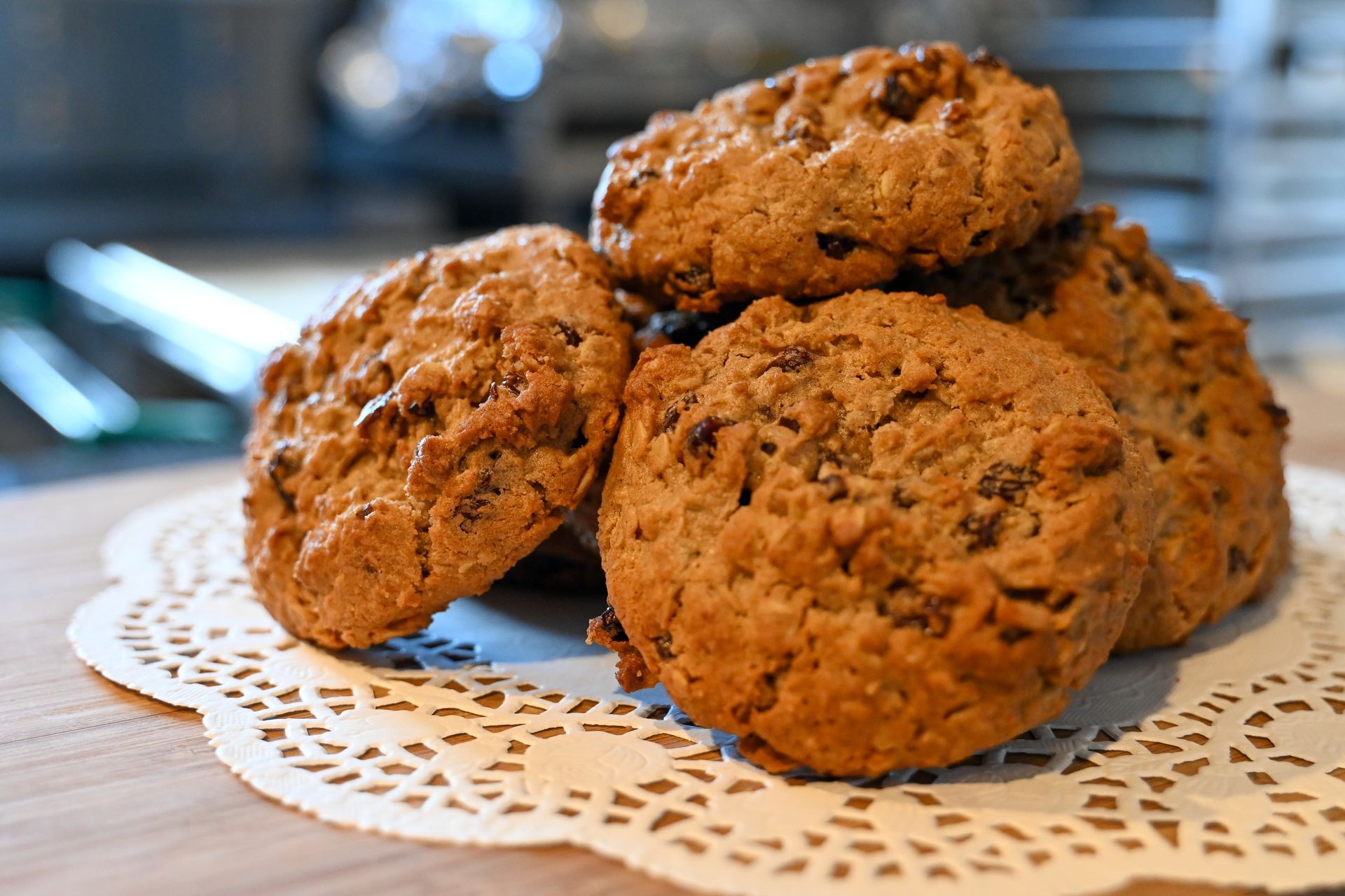 A stack of cookies on a napkin on a table.