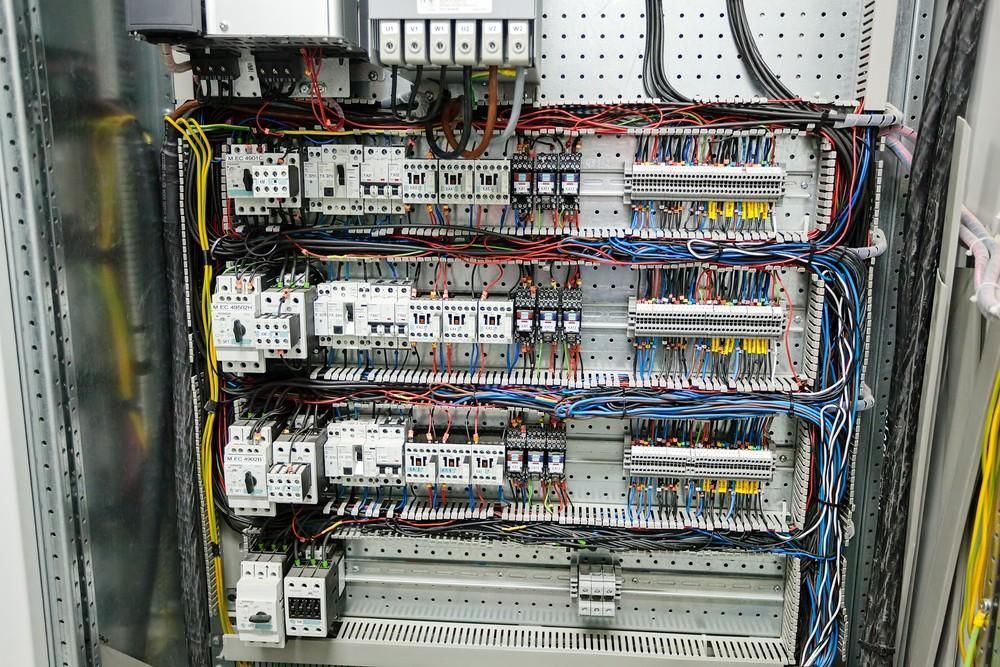 Electrical Control Panel With Numerous Wires, Relays, and Circuit Breakers — Robert Coony Electrician in Nambucca Heads, NSW