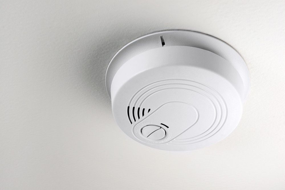 White Smoke Detector Mounted on a White Ceiling — Robert Coony Electrician in Nambucca Heads, NSW