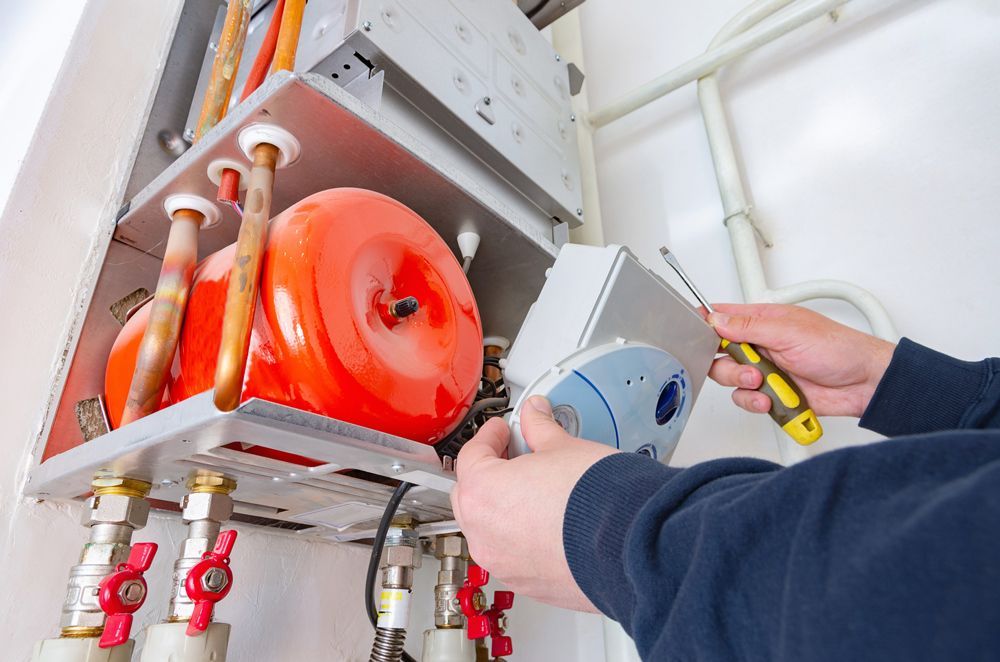 Repairing A Red Gas Boiler — Lansdale, PA — Abbey Plumbing & HVAC