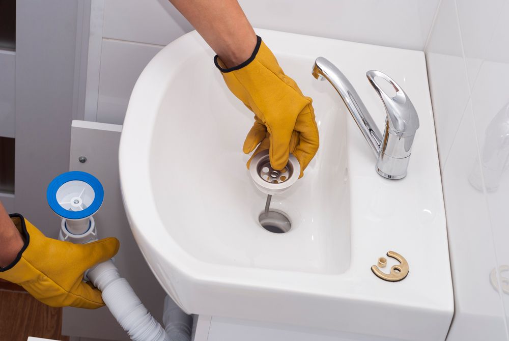 Cleaning Bathroom Sink — Lansdale, PA — Abbey Plumbing & HVAC Cleaning Bathroom Sink — Lansdale, PA — Abbey Plumbing & HVAC