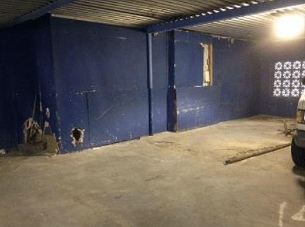 After photo of junk inside a garage