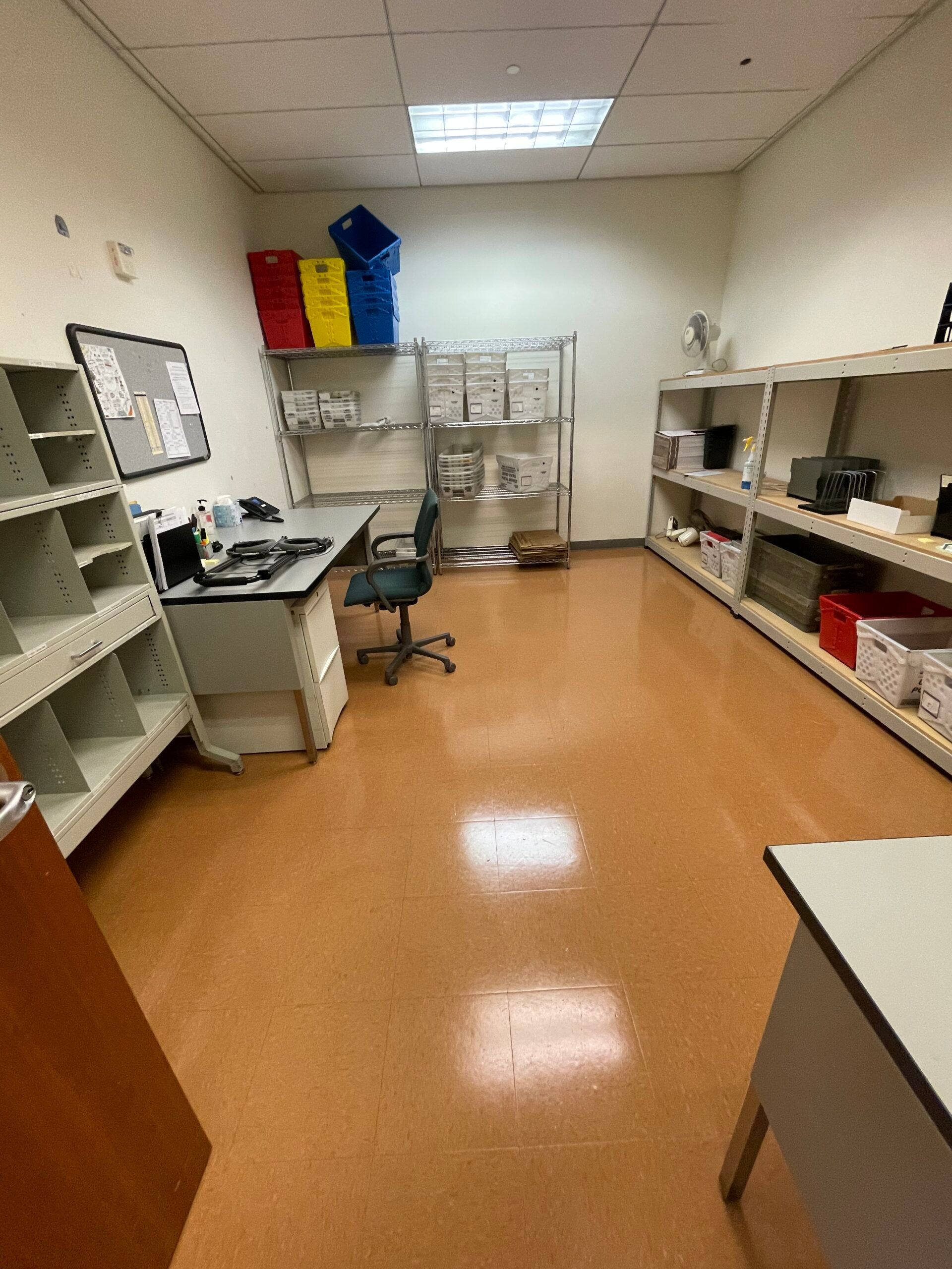 A logo for a & g facility is on a tile floor