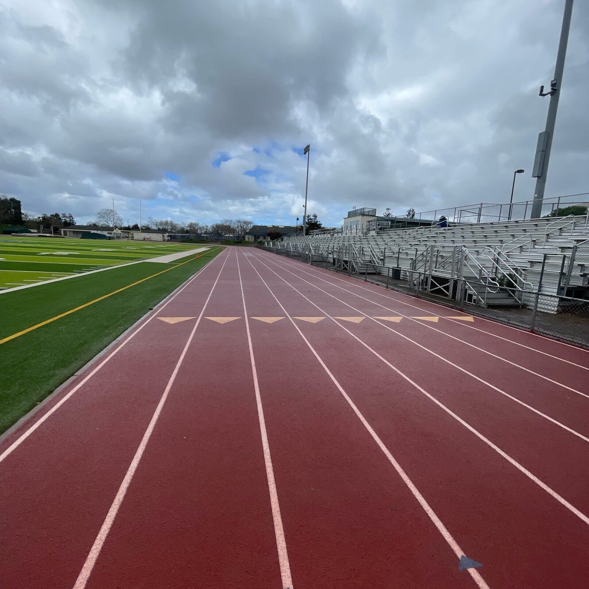A running track with arrows pointing to the left and right