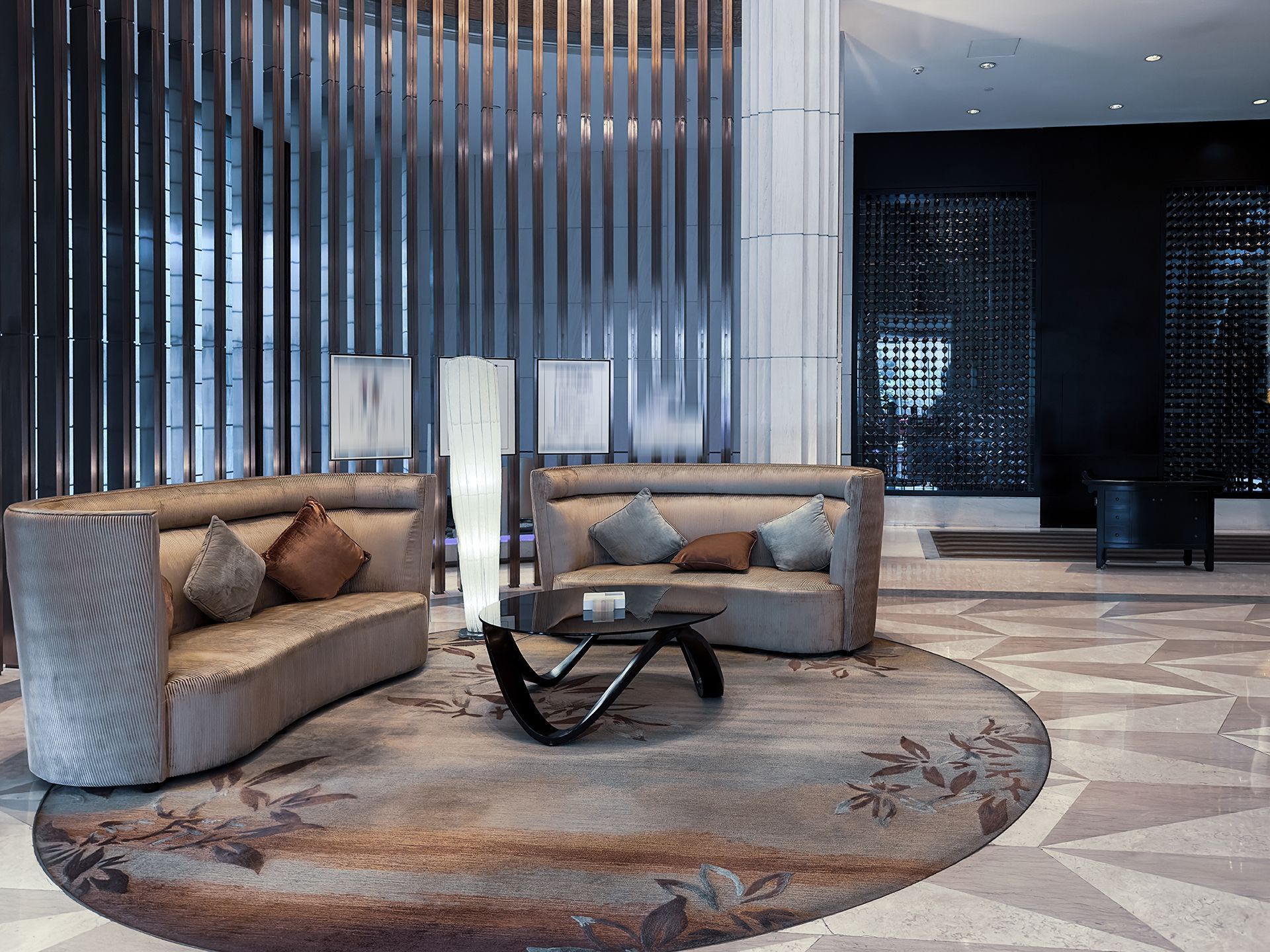 A living room with a couch , table , and rug.