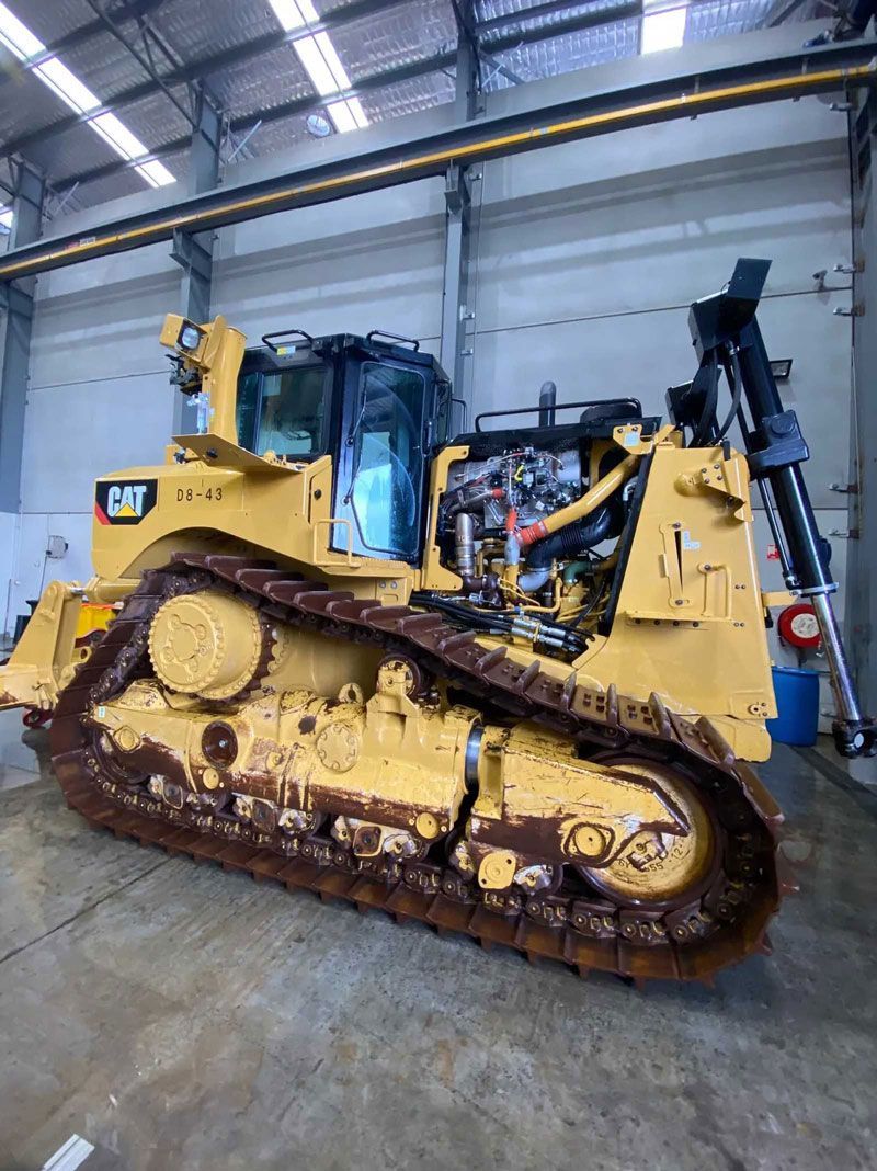 Yellow Bulldozer in Warehouse — Auto Electrical Services in Illawarra, NSW