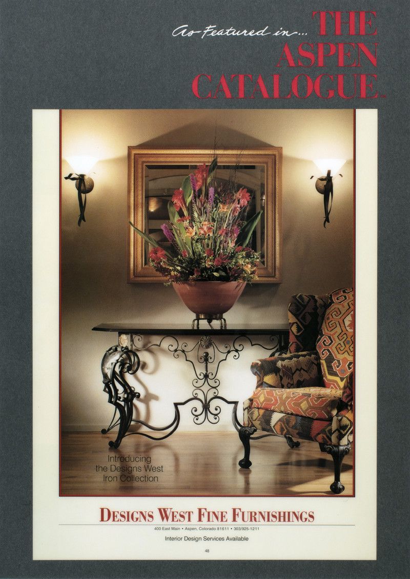 Book cover of a formal dining room with ornate console table, flowers, mirror, and wall sconces.