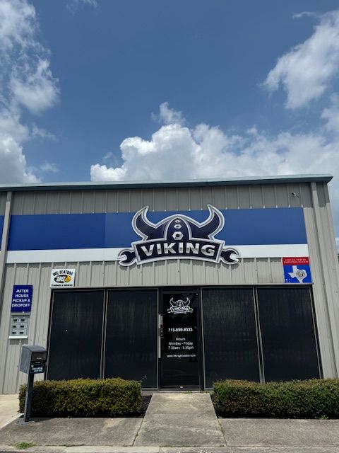 Viking storefront with blue sign and logo on a cloudy day