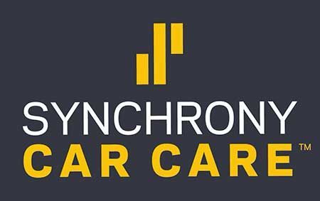 Synchrony Car Care logo on dark gray with yellow bars and text