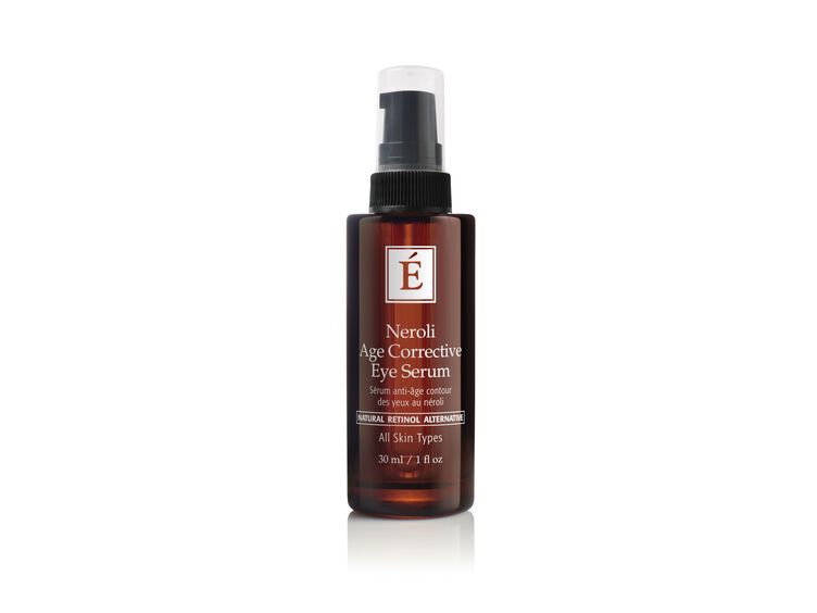 Brown bottle of eye serum with a pump dispenser, white label, and logo.