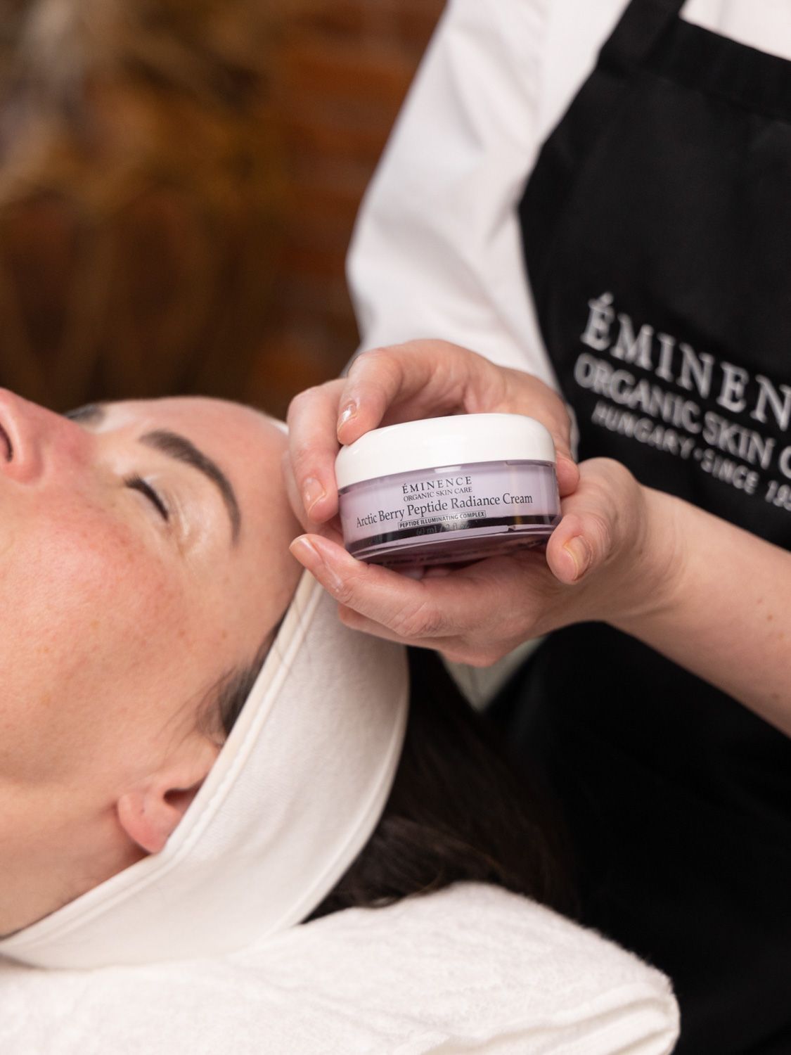 Eminence Organic Skin Care Bakuchiol + Niacinamide Moisturizer jar, white lid, purple label, and text on a white background.