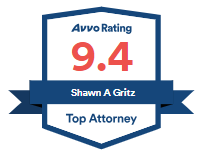 Avvo rating badge with 9.4, “Shawn A Gritz,” and “Top Attorney” on a blue ribbon