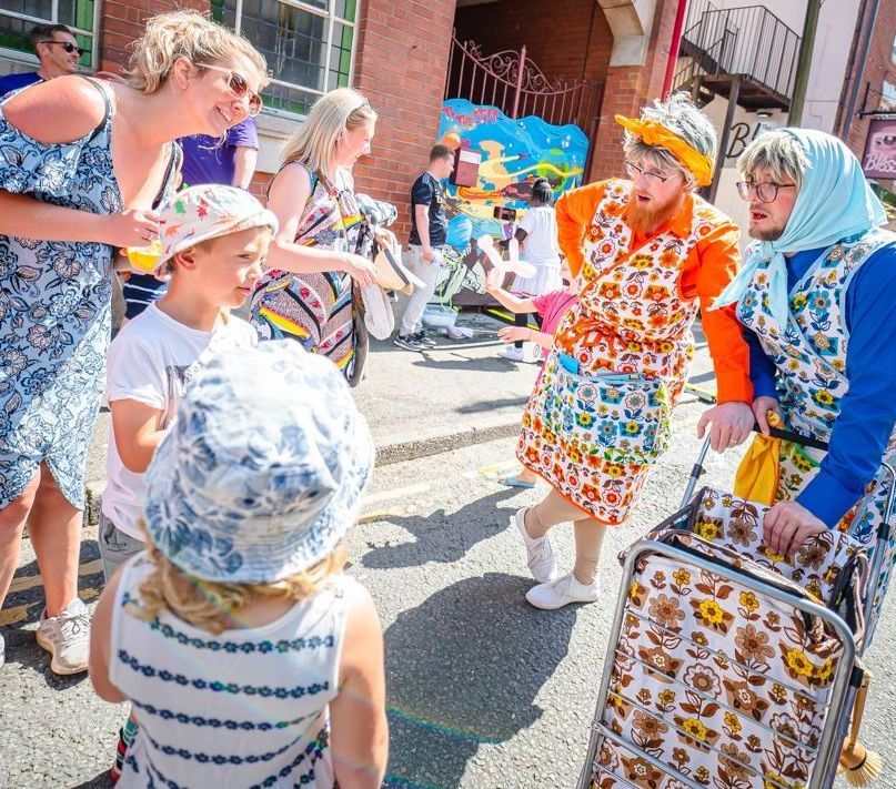 The Dustbusters street theatre act cleaning up at Deda's Big Book Bonanza event..