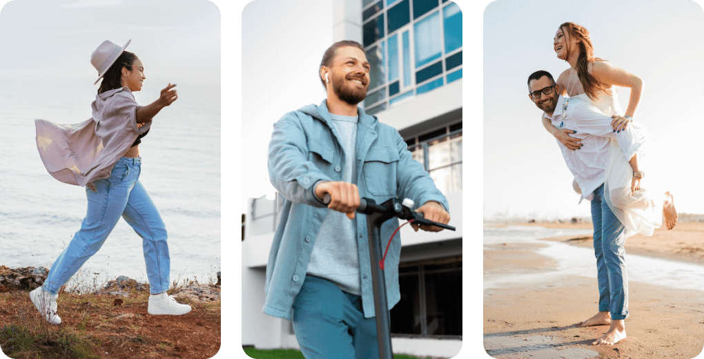 Three adults walking and smiling outdoors near a beach and modern building