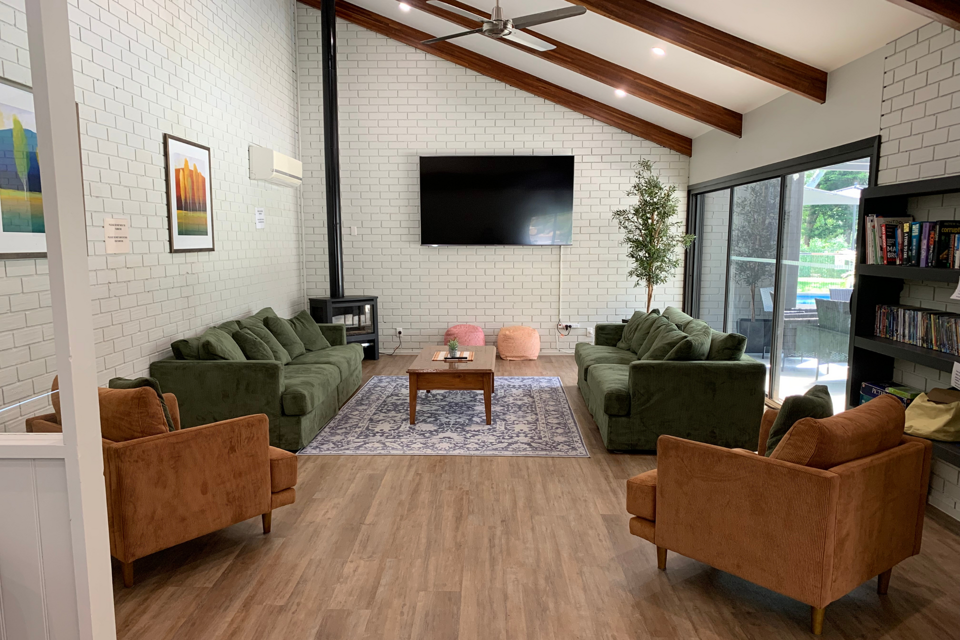 A living room filled with furniture and a flat screen tv.