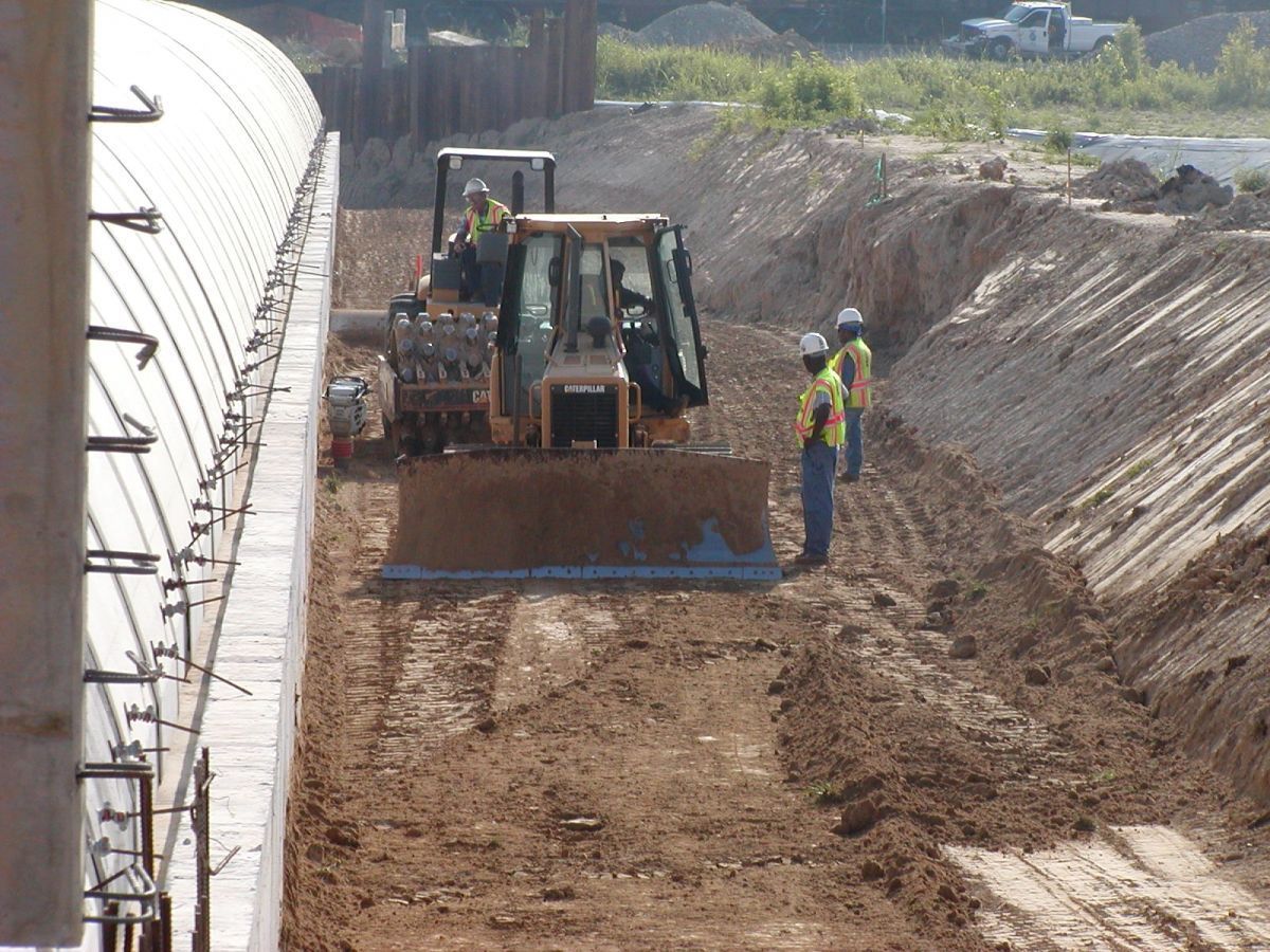 A bulldozer is moving dirt on a construction site