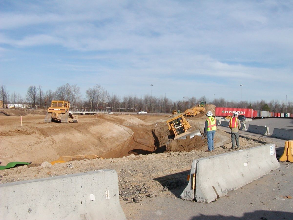 A group of construction workers are working on a construction site.
