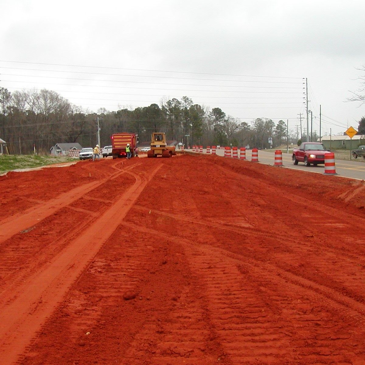 A road with a lot of red dirt on it